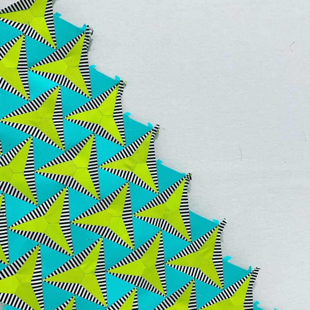 Turquoise fabric with lime triangular pattern