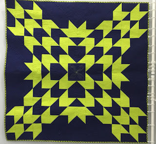 Navy and neon green geometric star quilt