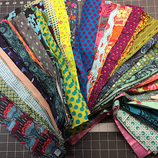Colorful fanned assortment of patterned fabric swatches