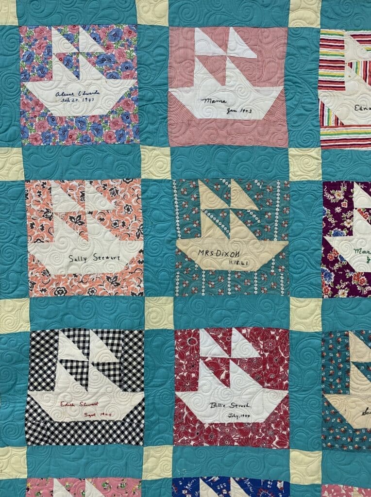 Signature patchwork quilt featuring boat blocks
