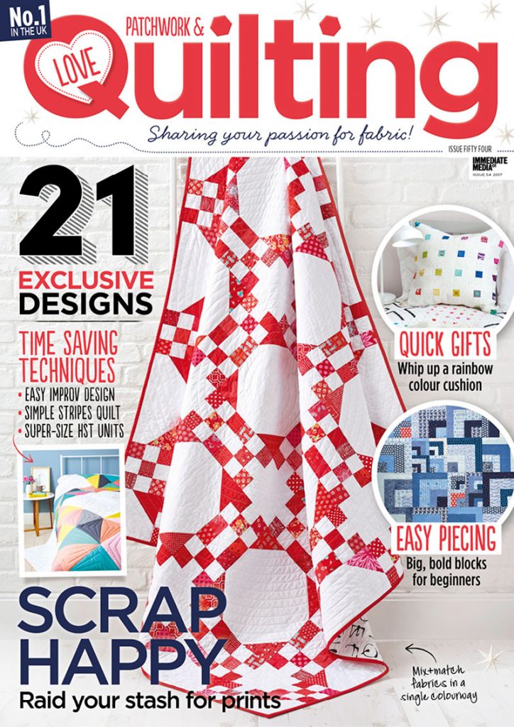 A magazine cover with some red and white quilt designs.