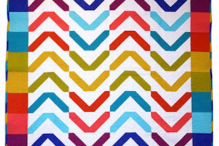 Colorful chevron quilt with rainbow stripes