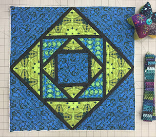 Blue and green concentric diamond quilt block