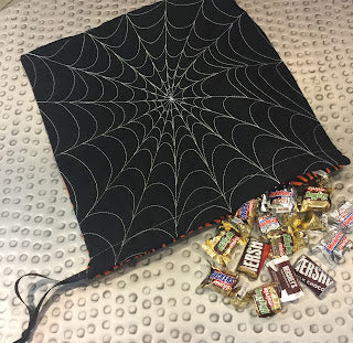 Spiderweb drawstring bag with chocolate candies
