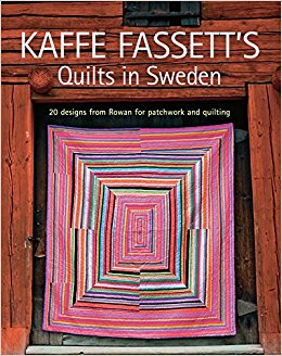 A book cover with a picture of a quilt.