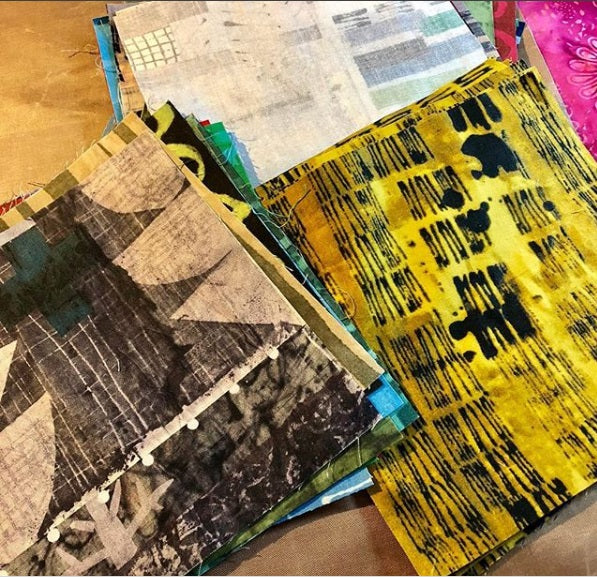 A table with several different colored papers on it.