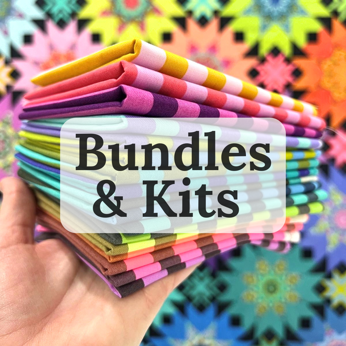 a hand holding up a bundle of very bright and colorful fat quarters with the word Bundles on the image
