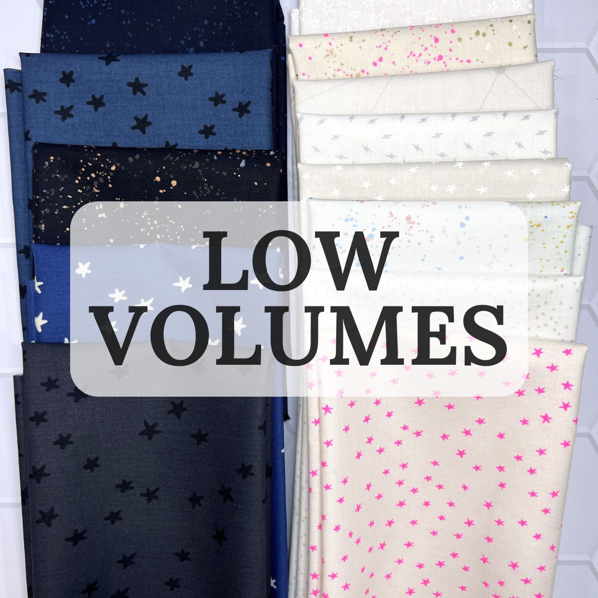 Different color fabrics with the words Low Volumes on the image