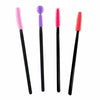 A group of four different colored mascara brushes.