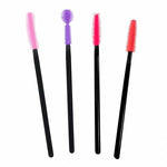 A group of four different colored mascara brushes.