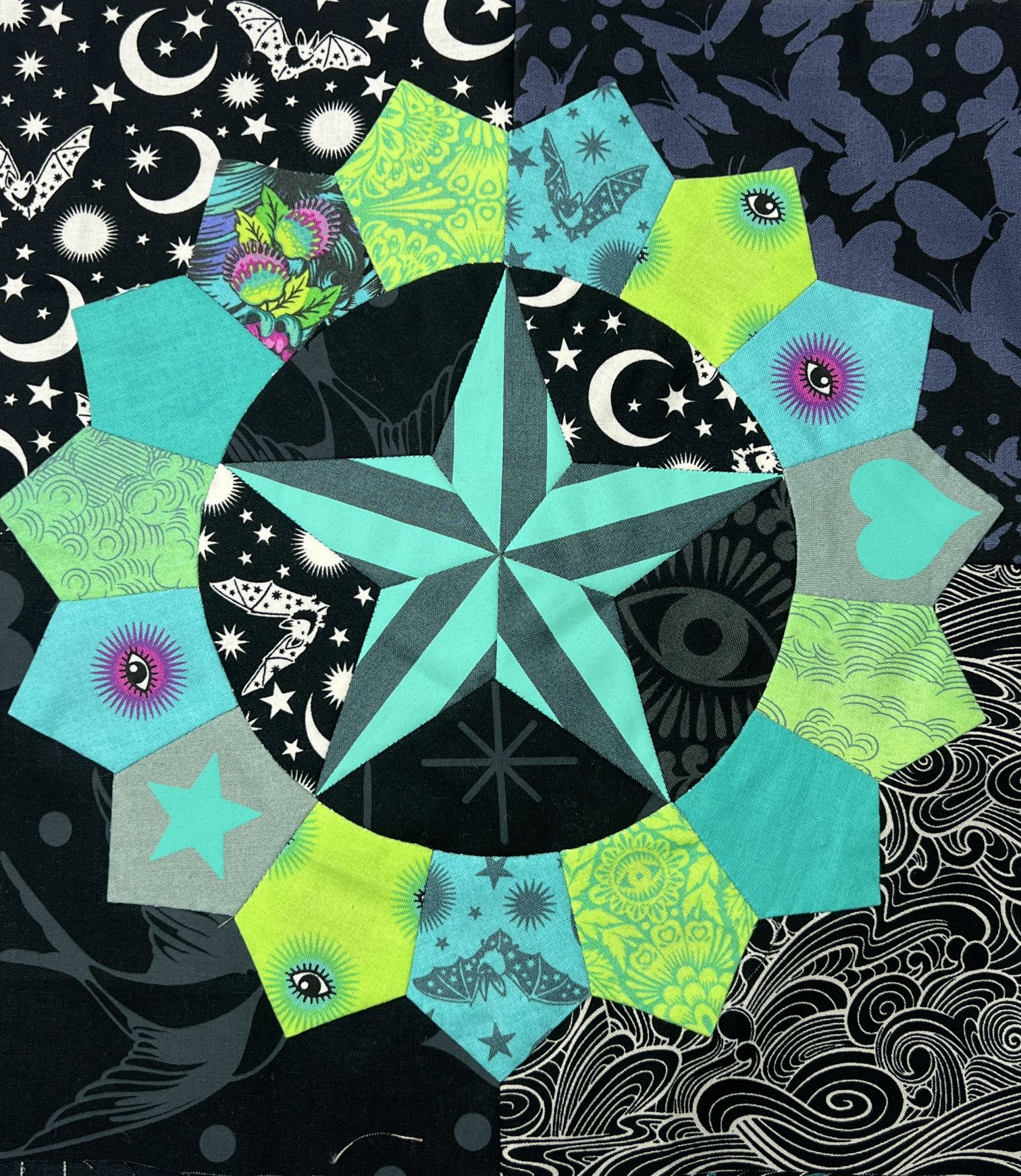 Colorful star pattern with geometric shapes on a celestial background.