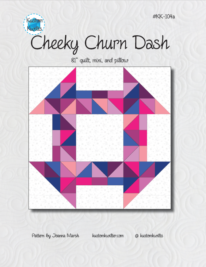 A quilt pattern with pink and purple triangles.