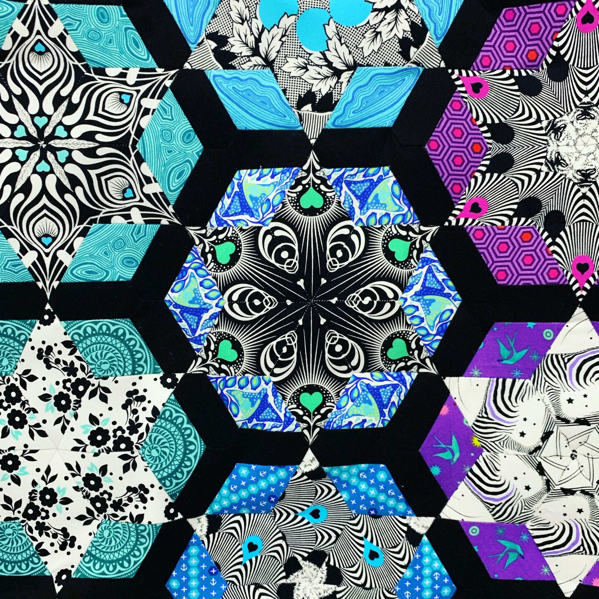 A close up of the hexagons on a quilt