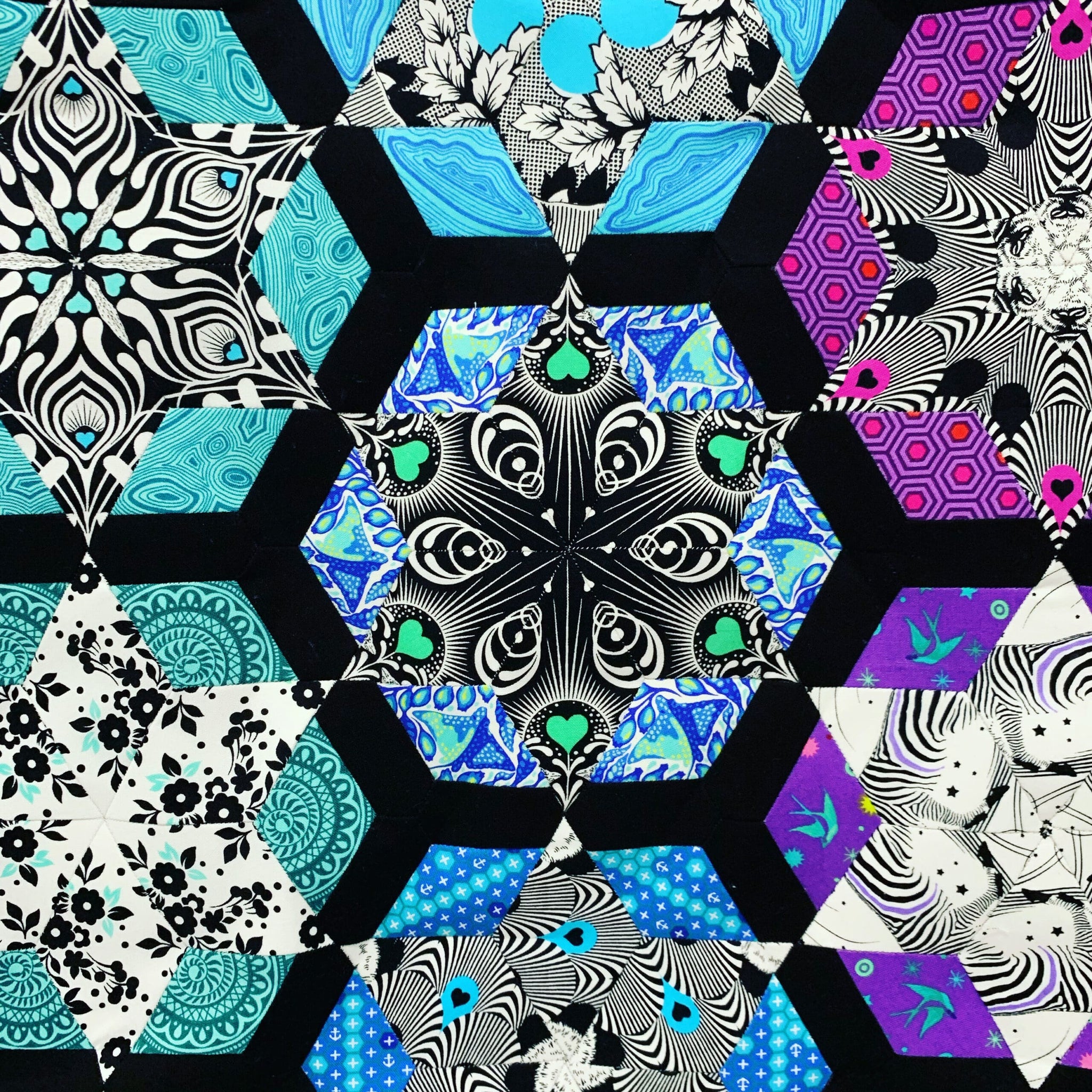 A close up of the hexagons on a quilt