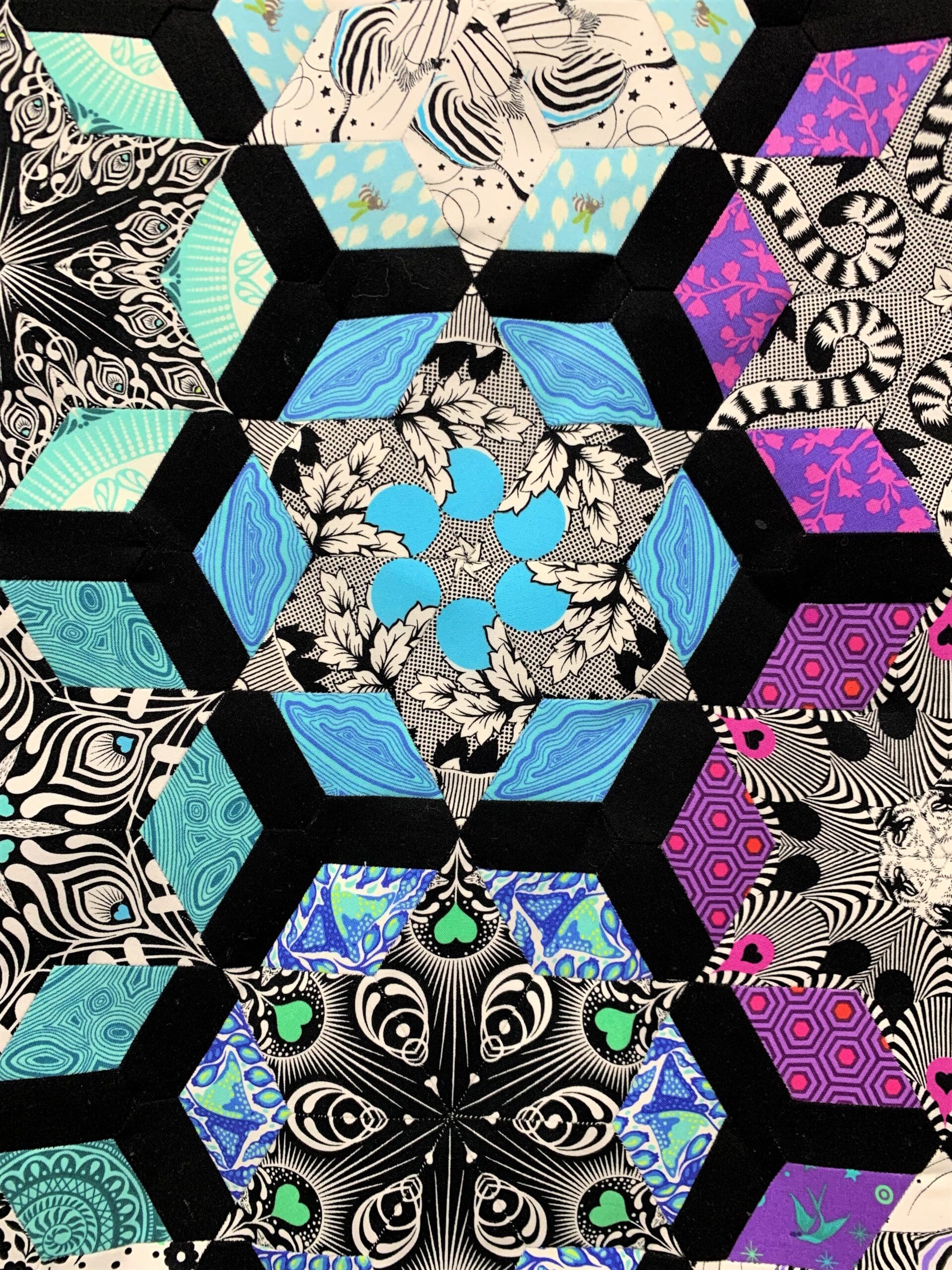 A close up of the hexagons in a quilt