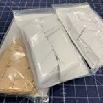 A close up of three bags of paper