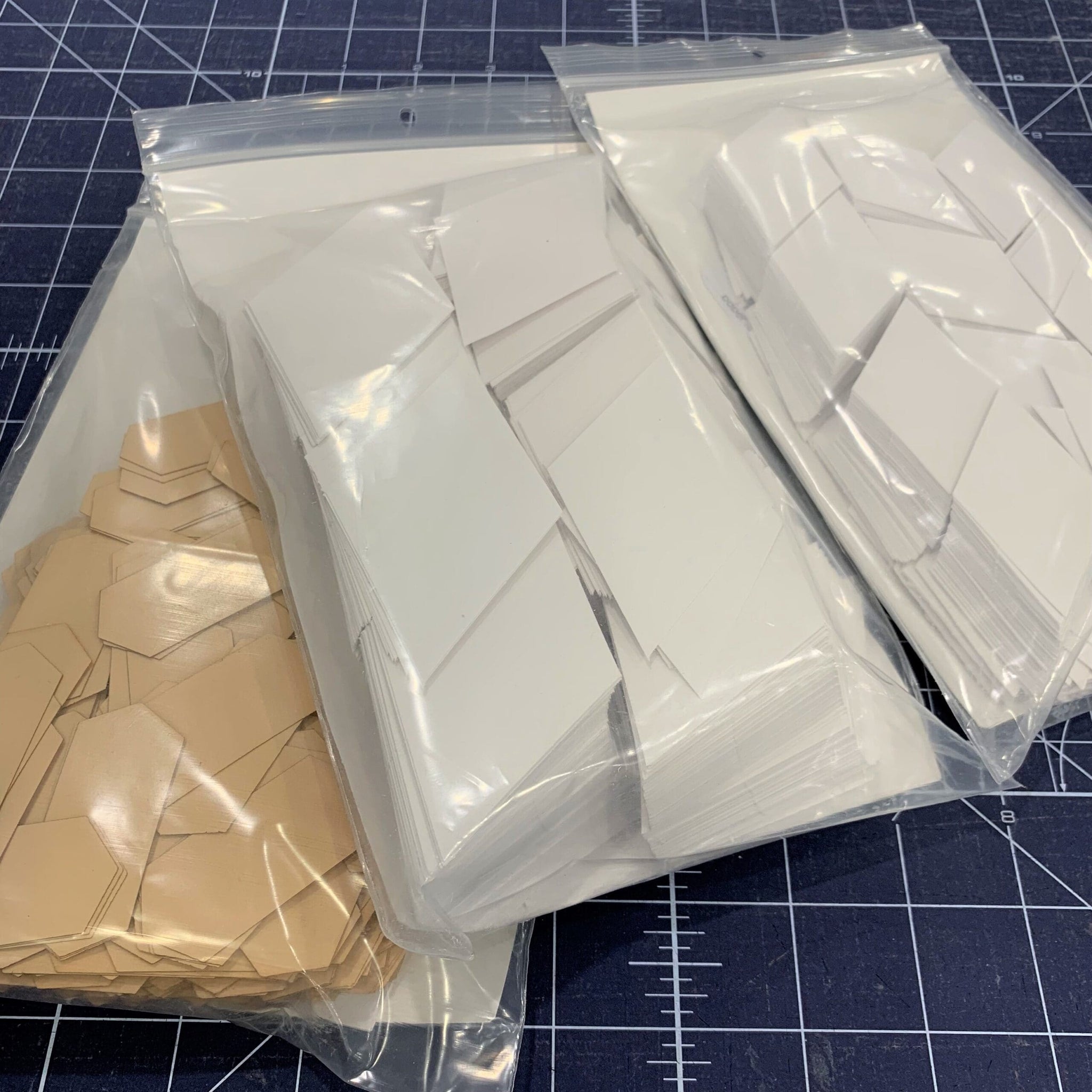 A close up of three bags of paper