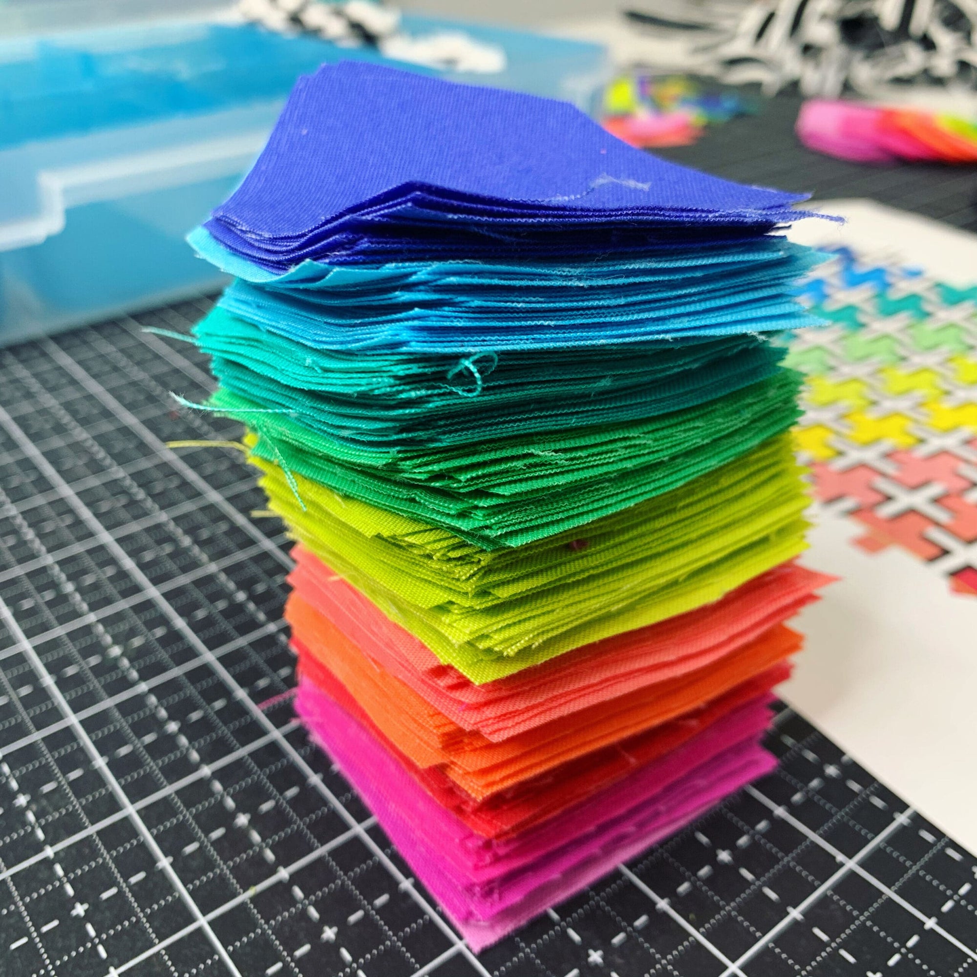 A stack of colored paper on top of a table.