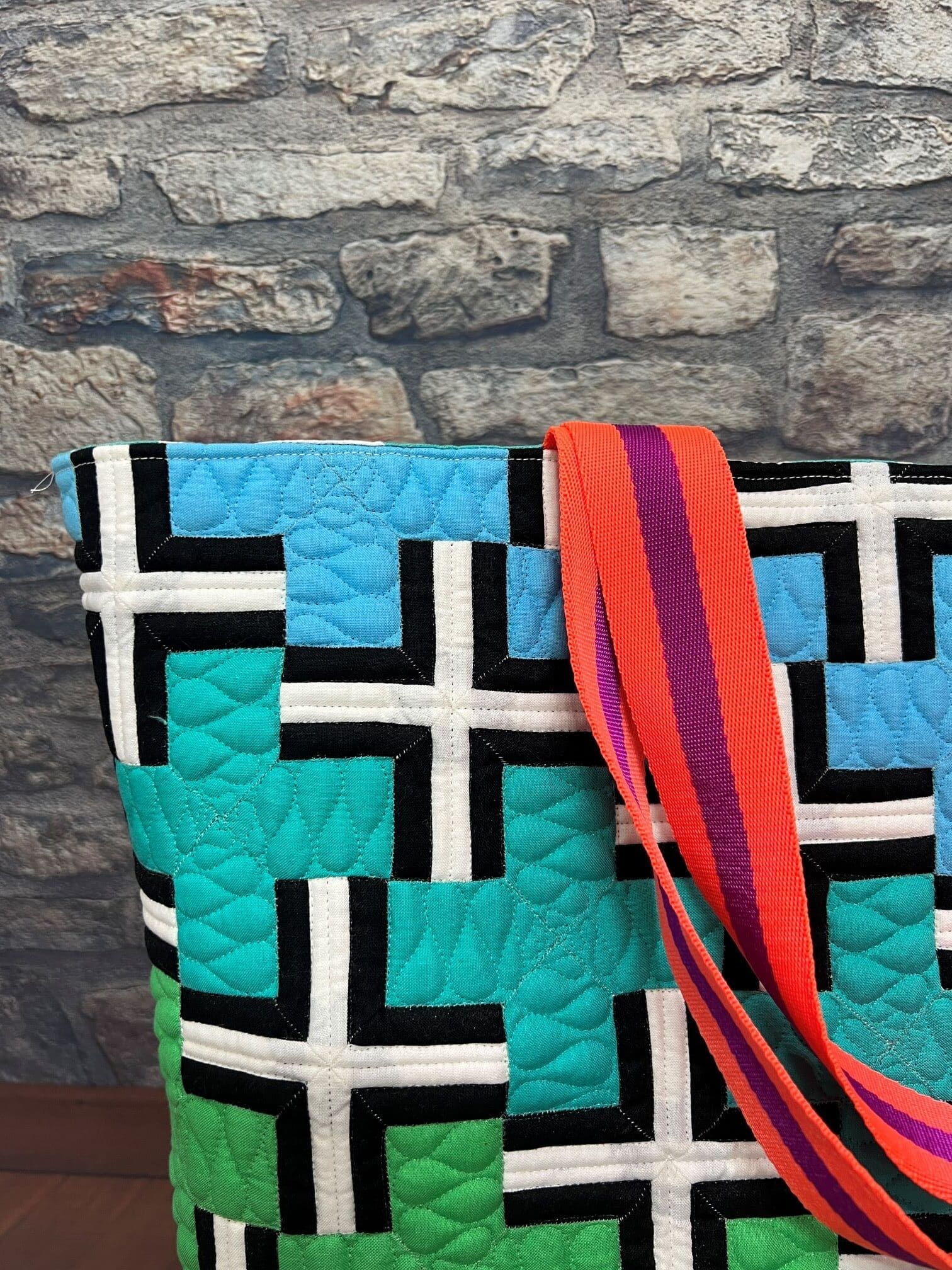 A close up of the shoulder strap on a bag