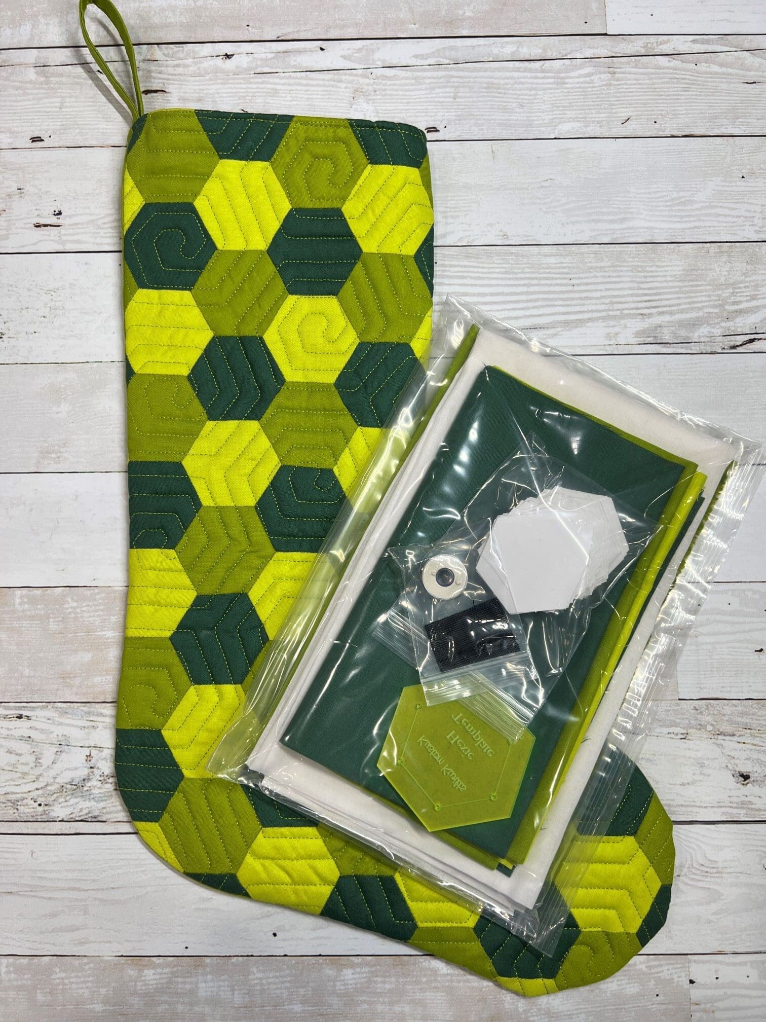A green and yellow mat with a box of beads