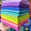 A stack of colorful fabric is shown.