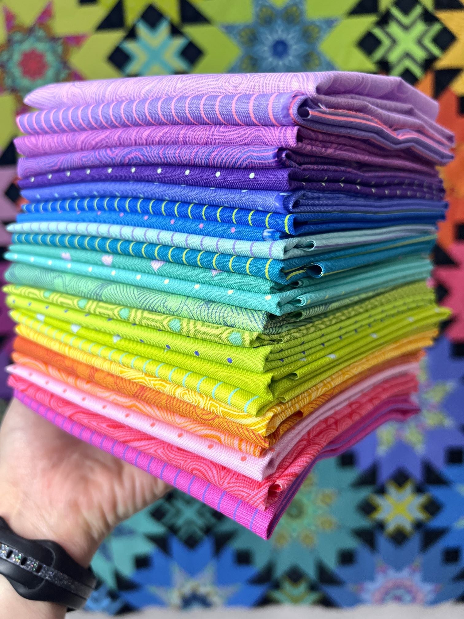 A stack of colorful fabric is shown.