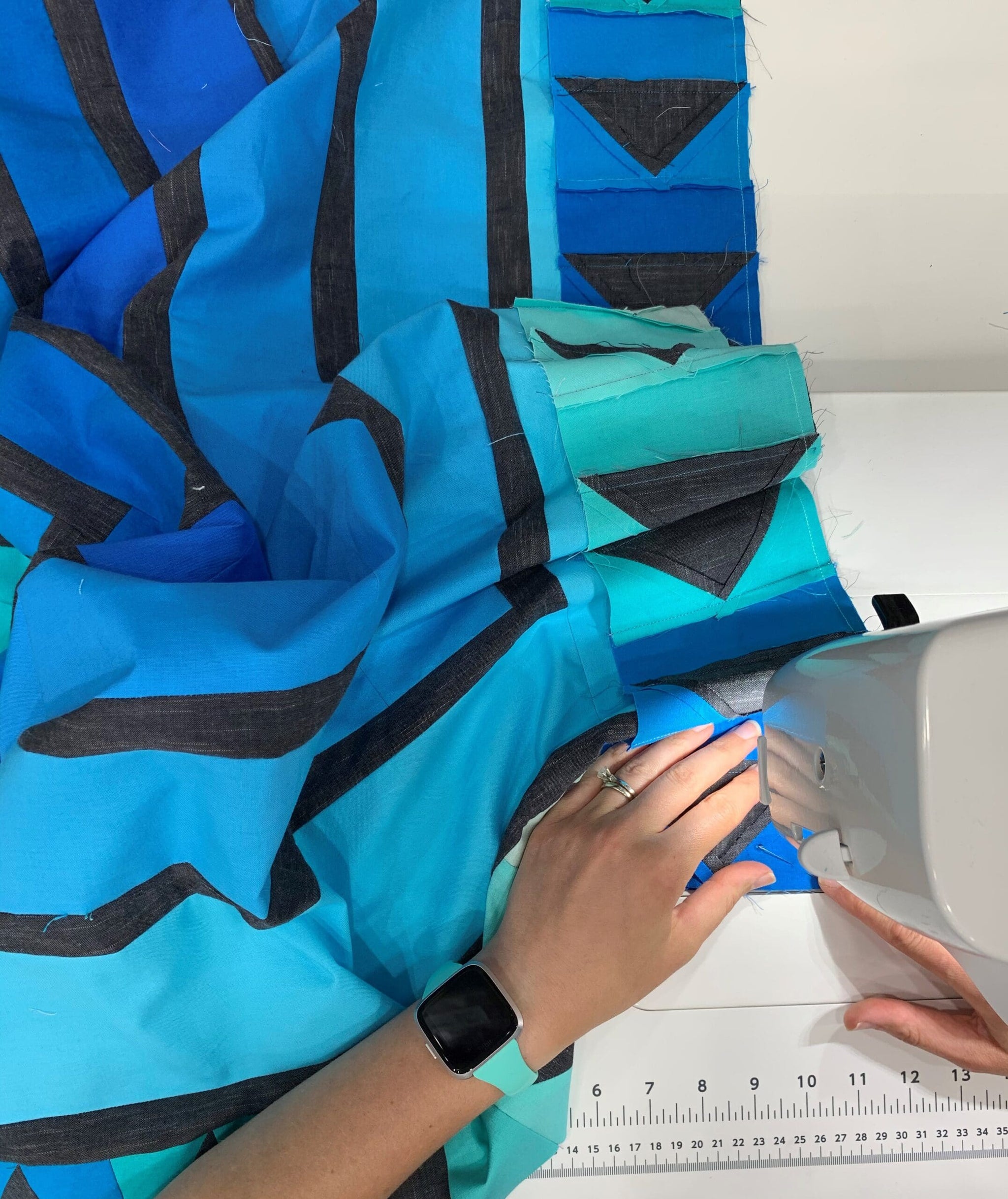 A person using an ipad on top of a table.