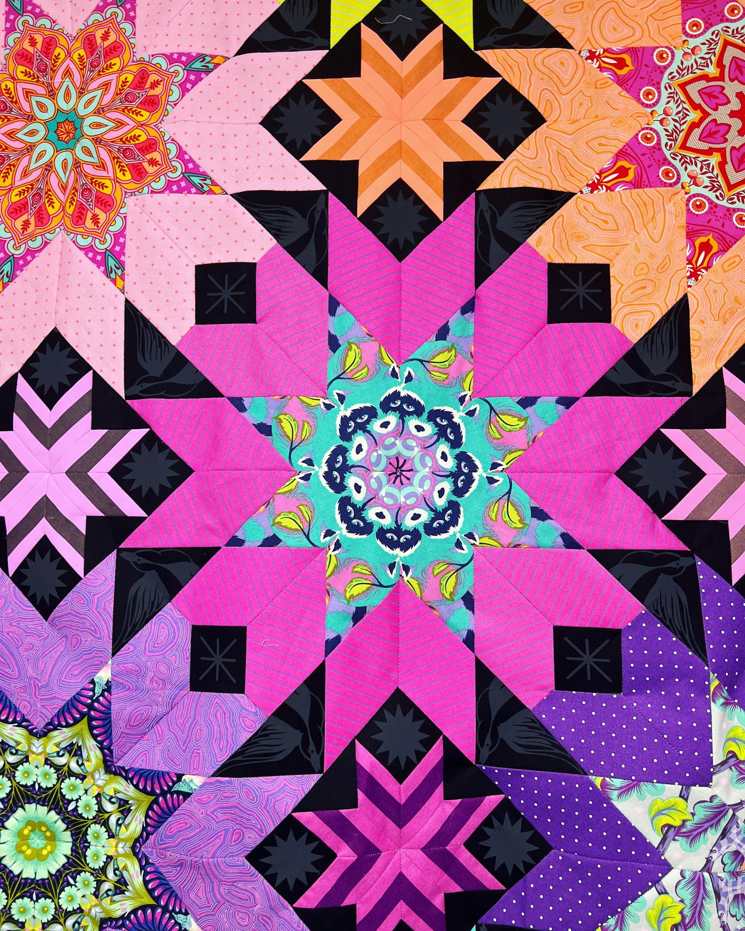 A close up of the center of a quilt