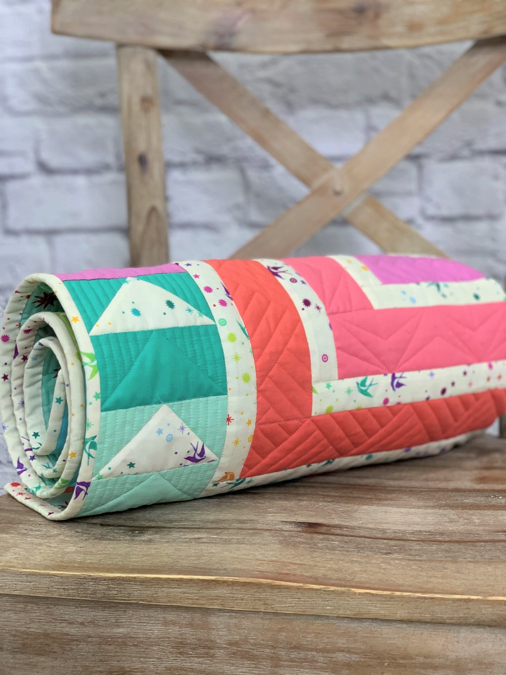 A roll of fabric on top of a wooden table.