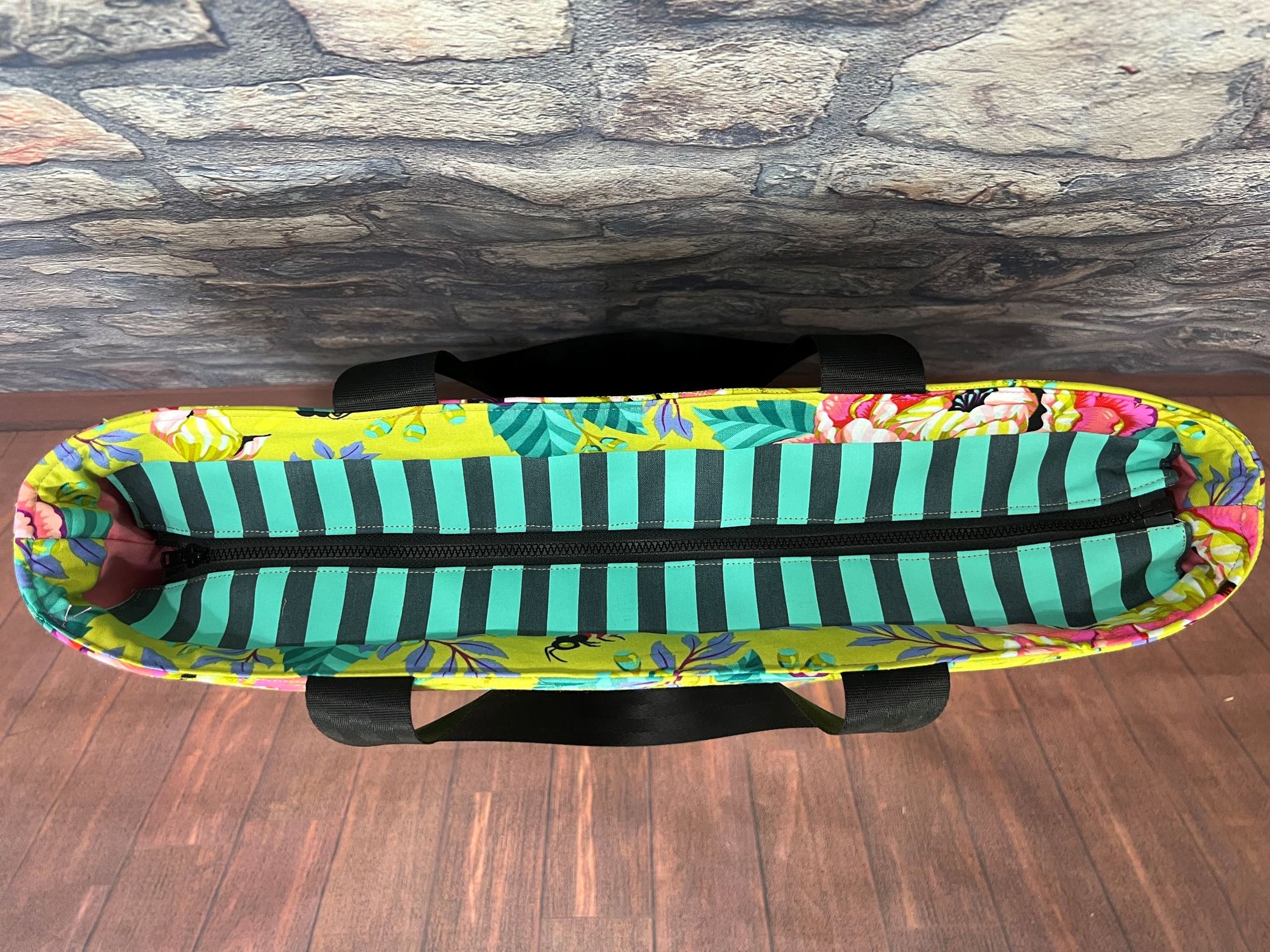 A surfboard sitting on top of a wooden floor.