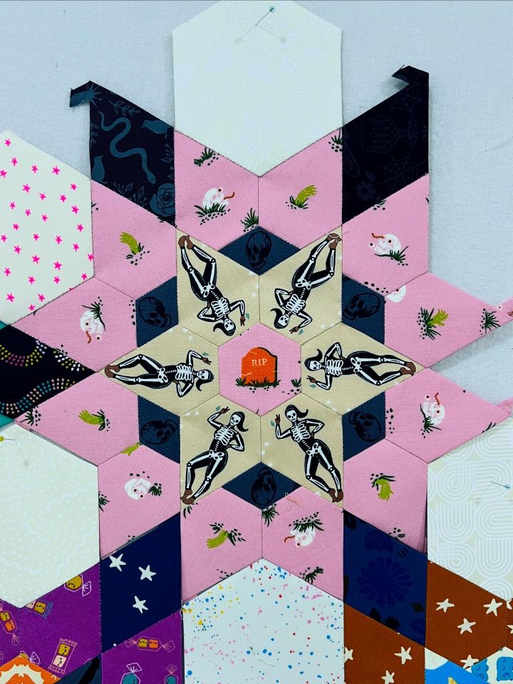 A colorful geometric star pattern with various designs and colors.