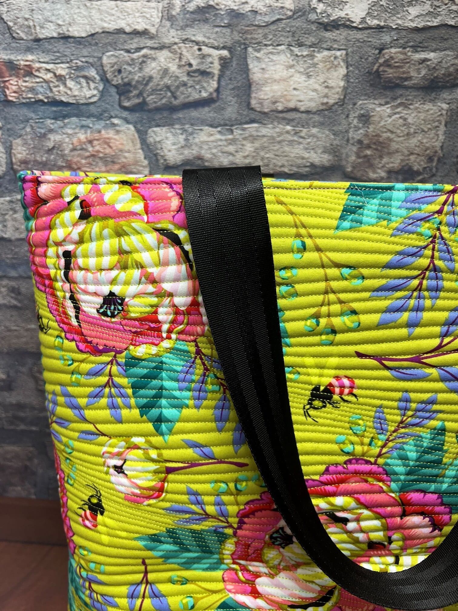 A close up of the shoulder strap on a bag
