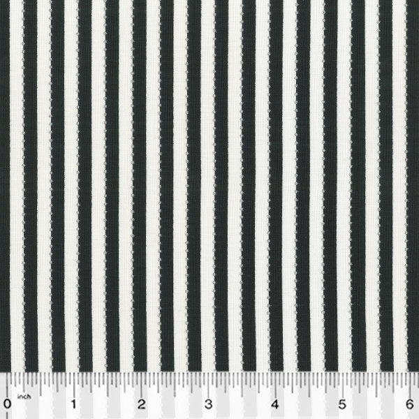 A black and white striped fabric with a ruler