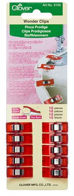 A red and white package of clips for sewing