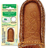 A brown leather thimble with a stitch on it.