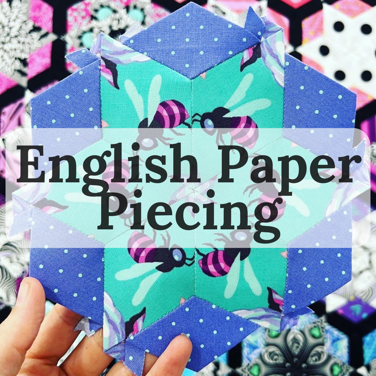 A hand holds a handmade hexagonal quilt block made from patterned fabrics, featuring blue polka-dot borders, a mint green center with bee prints, and a large semi-transparent text overlay reading 'English Paper Piecing'.