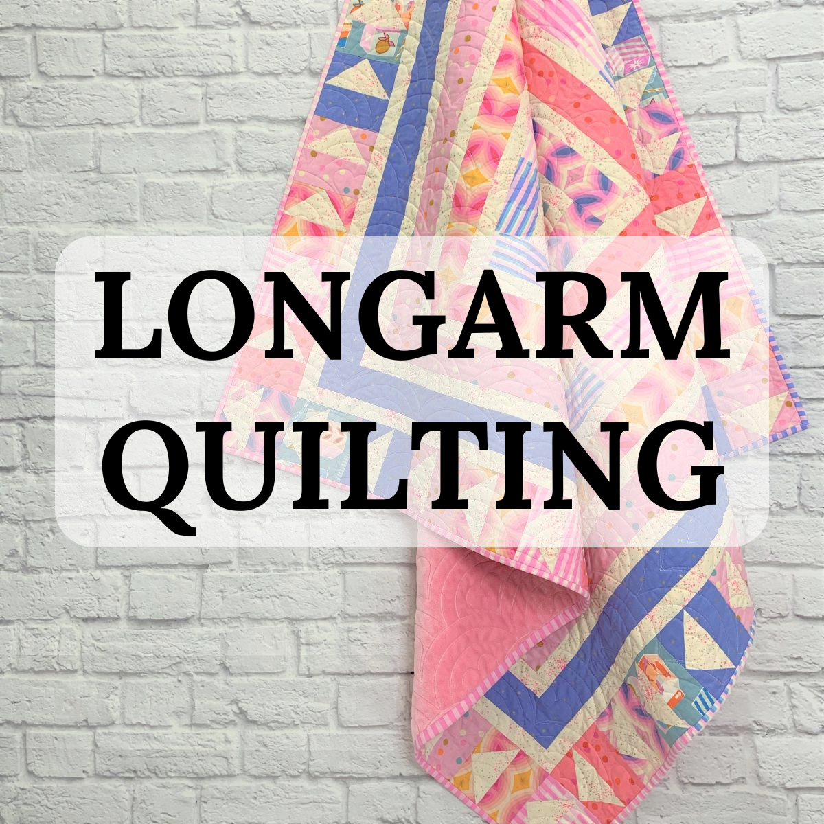 Photo of a gorgeous colorful quilt on a white brick wall with the words Longarm Quilting on it