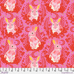 A pink and red pattern with some yellow and white rabbits