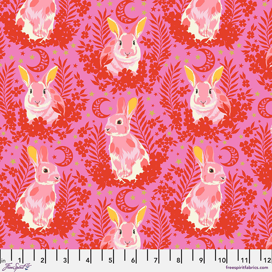 A pink and red pattern with some yellow and white rabbits