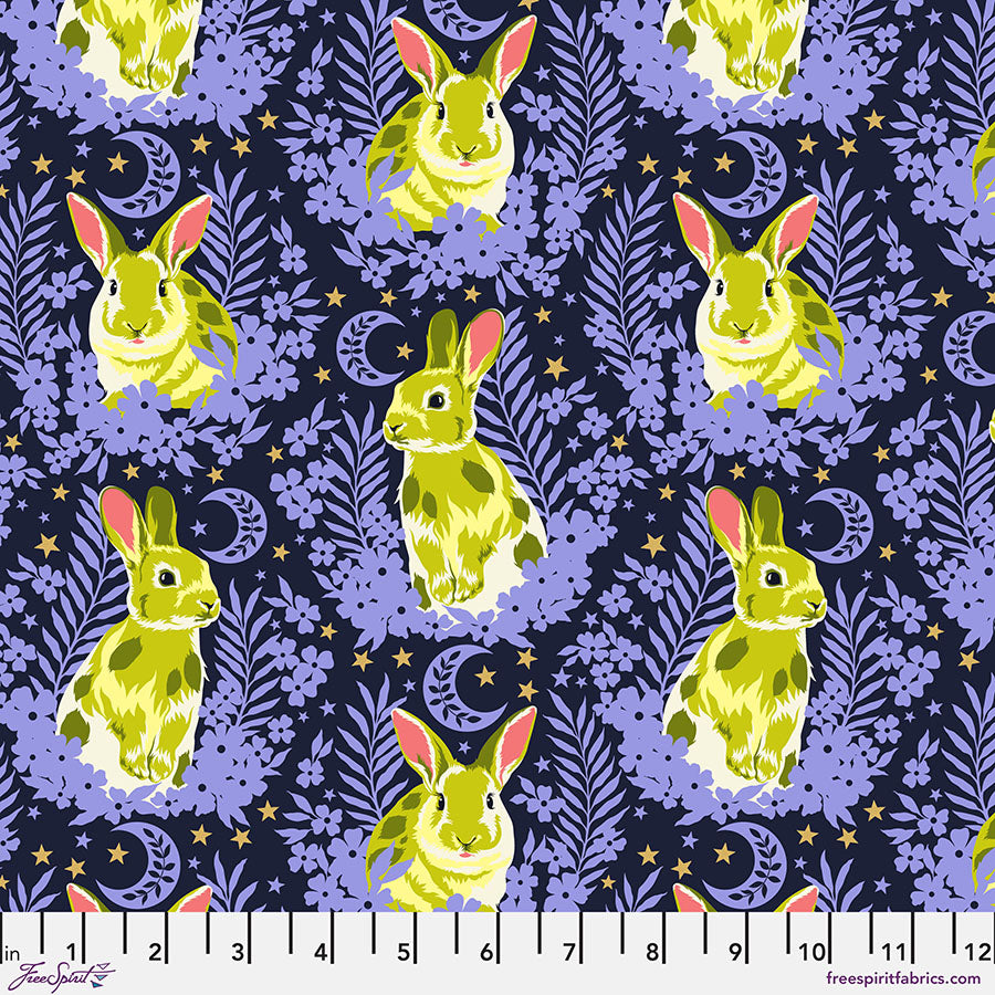 A pattern of rabbits and flowers on a dark background.