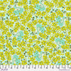 A green and yellow floral pattern on fabric.