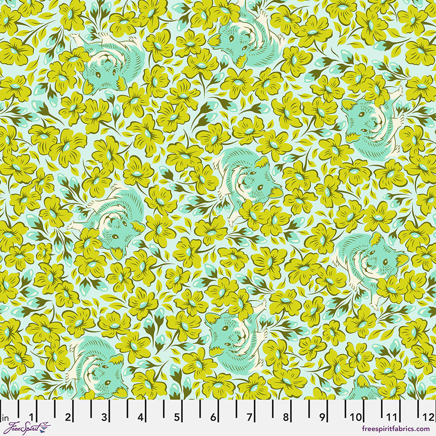 A green and yellow floral pattern on fabric.