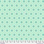 A green and pink pattern is on the ground.