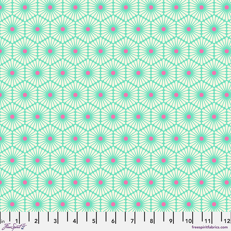 A green and pink pattern is on the ground.