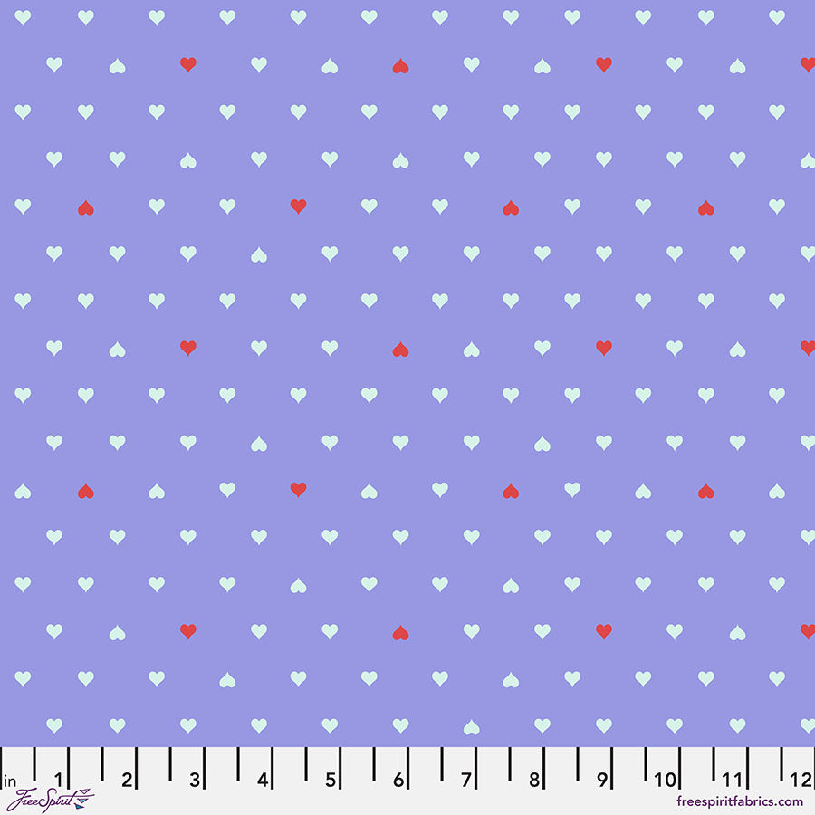 A purple background with white and red polka dots.