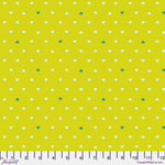 A yellow polka dot fabric with white and green dots.