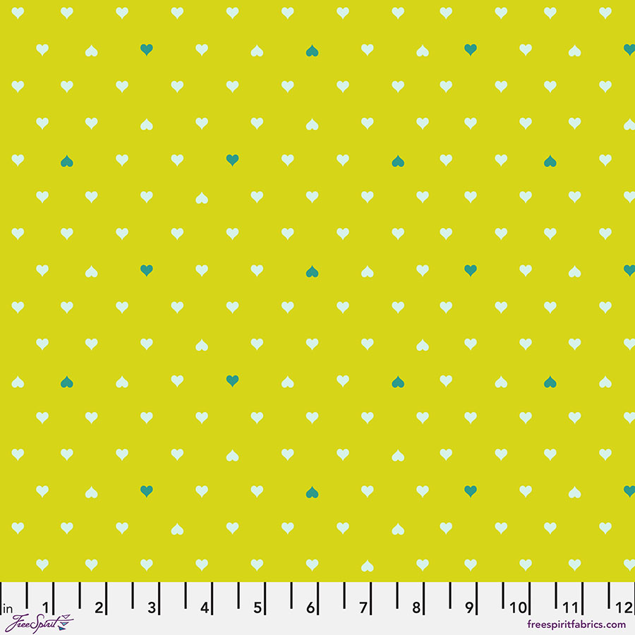 A yellow polka dot fabric with white and green dots.