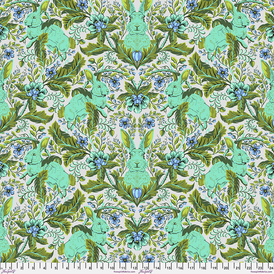 Intricate symmetrical pattern with green, blue, and beige tones.