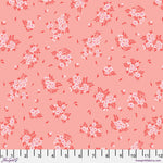 Pink fabric with small floral prints and white measuring tape.
