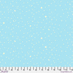 Light blue fabric with white snowflake pattern and ruler for scale.